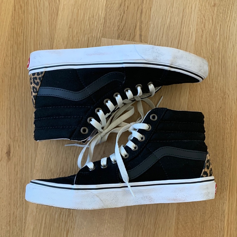 Vans high top skateboarding shoe. Black with animal print detail.